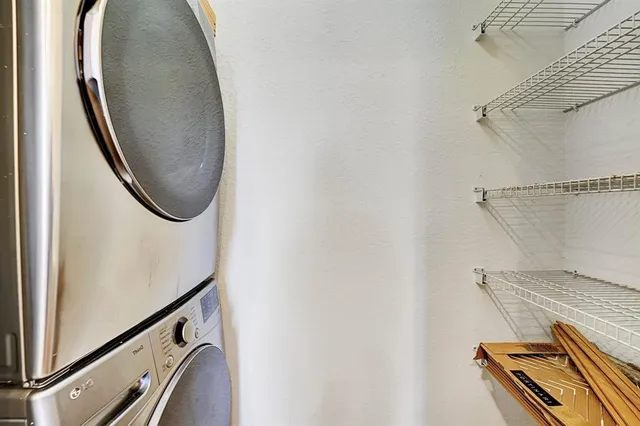 a kitchen with a refrigerator and a stove top oven
