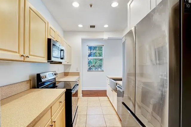 a kitchen that has a sink and a stove