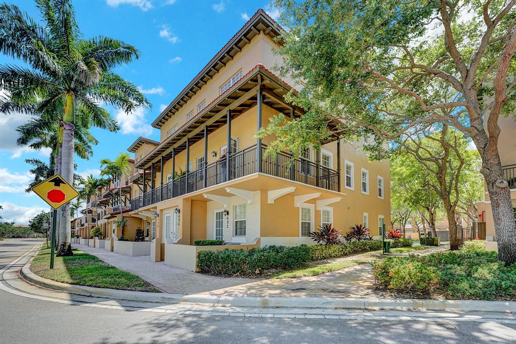 454 Southwest 147th Avenue, Unit 4601 Pembroke Pines, FL 33027 - Photo 2 of 45 a front view of a house with a yard and garage