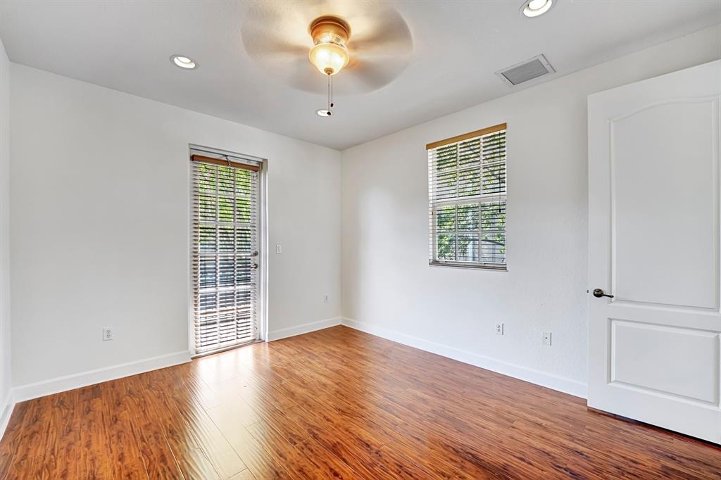 454 Southwest 147th Avenue, Unit 4601 Pembroke Pines, FL 33027 - Photo 22 of 45 an empty room with wooden floor and windows