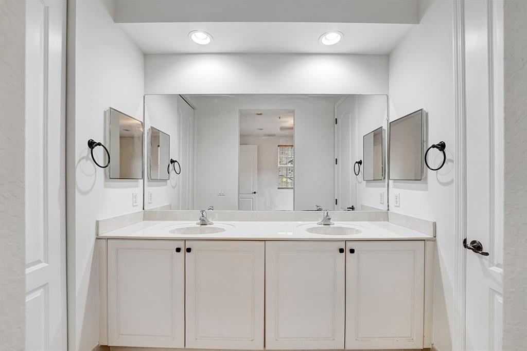 454 Southwest 147th Avenue, Unit 4601 Pembroke Pines, FL 33027 - Photo 23 of 45 a bathroom with a sink and a mirror