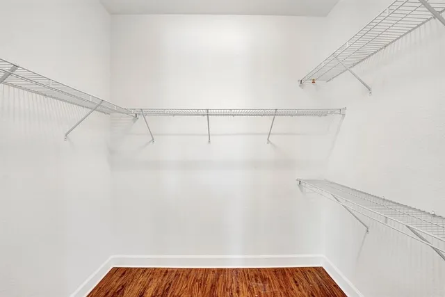 a view of a balcony with wooden fence and floor