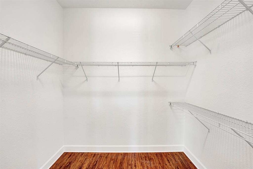 454 Southwest 147th Avenue, Unit 4601 Pembroke Pines, FL 33027 - Photo 25 of 45 a view of a room with racks on the wall