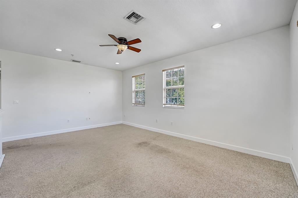 454 Southwest 147th Avenue, Unit 4601 Pembroke Pines, FL 33027 - Photo 30 of 45 an empty room with a window and a ceiling fan