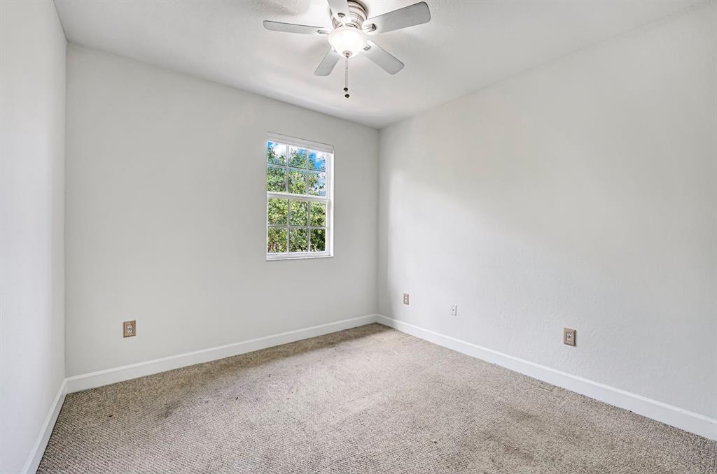454 Southwest 147th Avenue, Unit 4601 Pembroke Pines, FL 33027 - Photo 32 of 45 an empty room with a window and a fan
