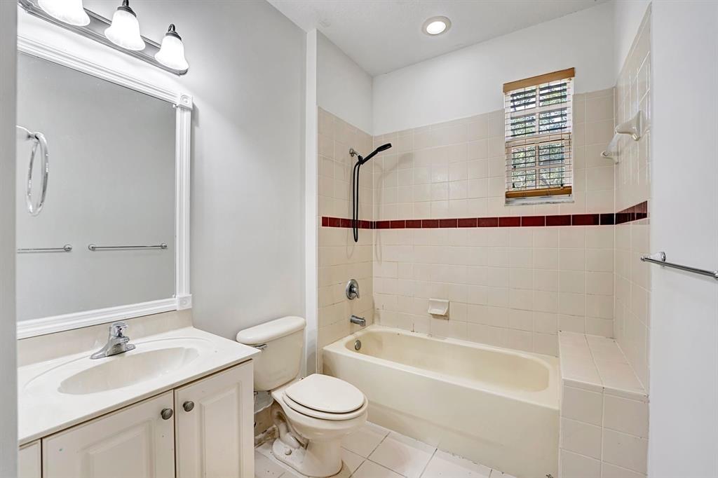 454 Southwest 147th Avenue, Unit 4601 Pembroke Pines, FL 33027 - Photo 34 of 45 a bathroom with a granite countertop sink toilet a mirror and bathtub