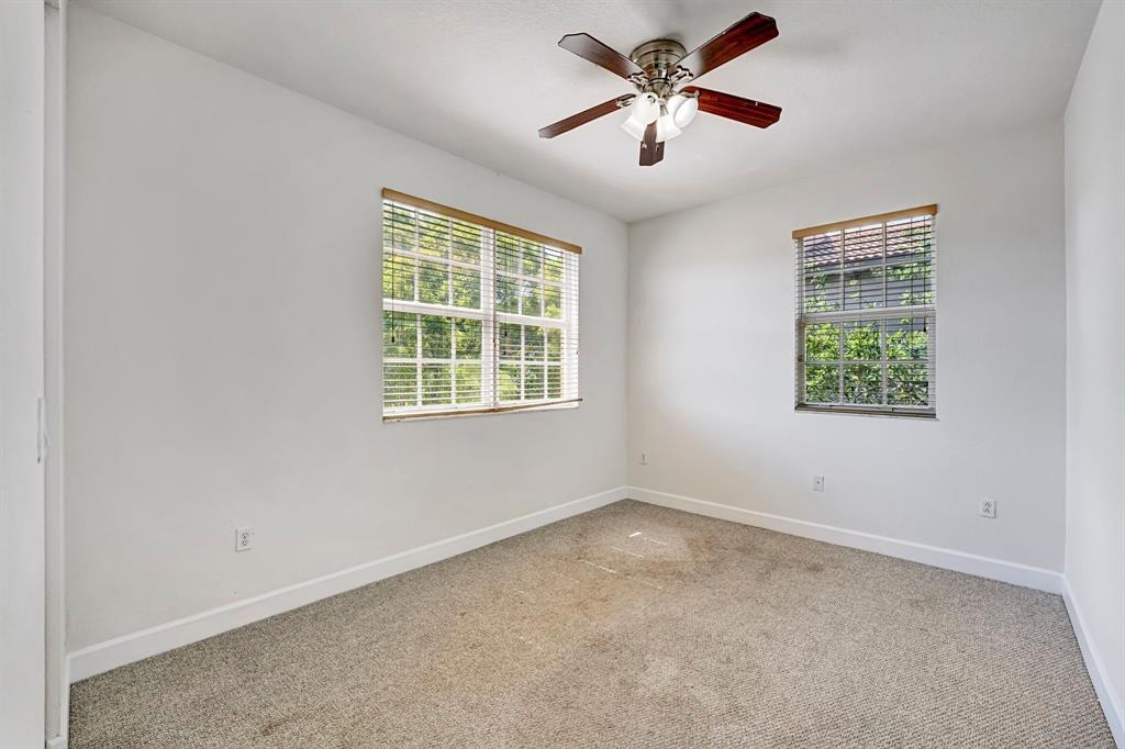 454 Southwest 147th Avenue, Unit 4601 Pembroke Pines, FL 33027 - Photo 35 of 45 an empty room with a window and a fan