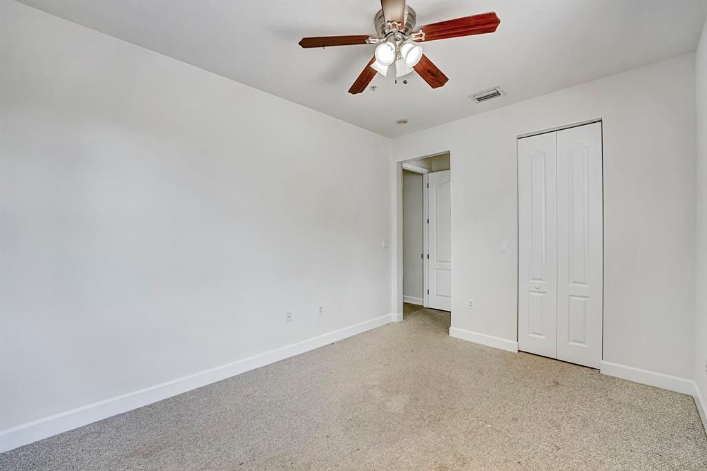 454 Southwest 147th Avenue, Unit 4601 Pembroke Pines, FL 33027 - Photo 36 of 45 an empty room with closet and a chandelier fan