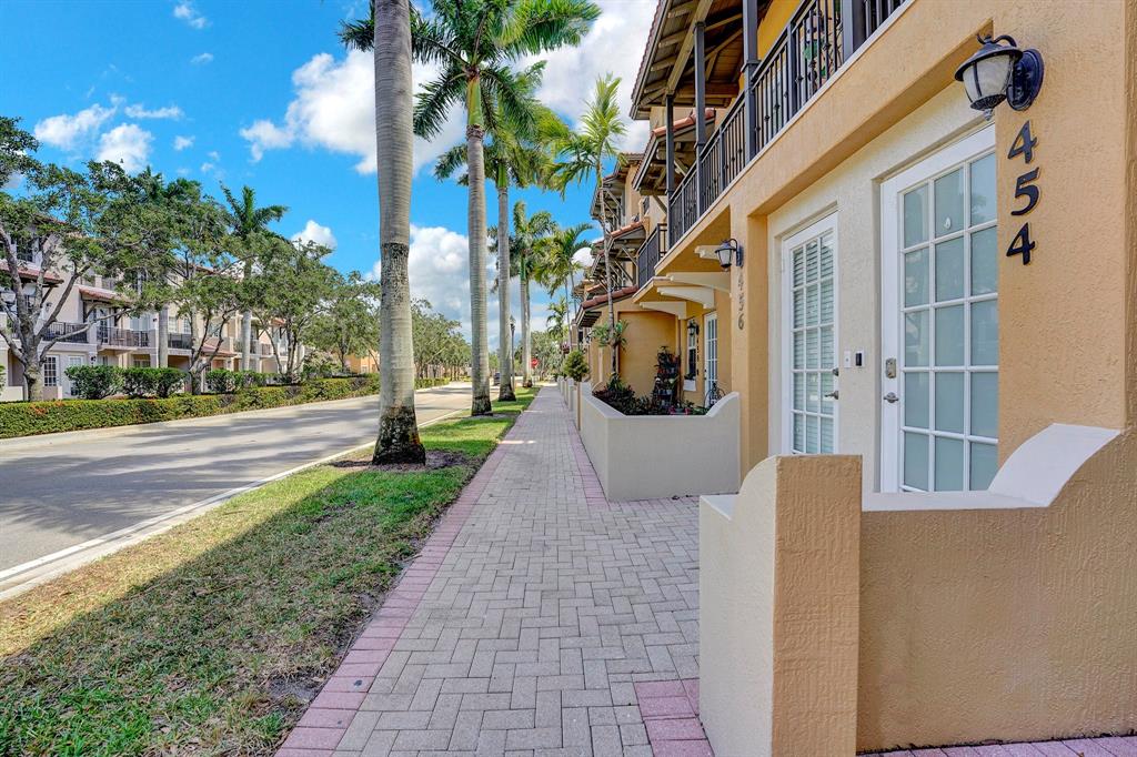 454 Southwest 147th Avenue, Unit 4601 Pembroke Pines, FL 33027 - Photo 4 of 45 a view of a building with a yard