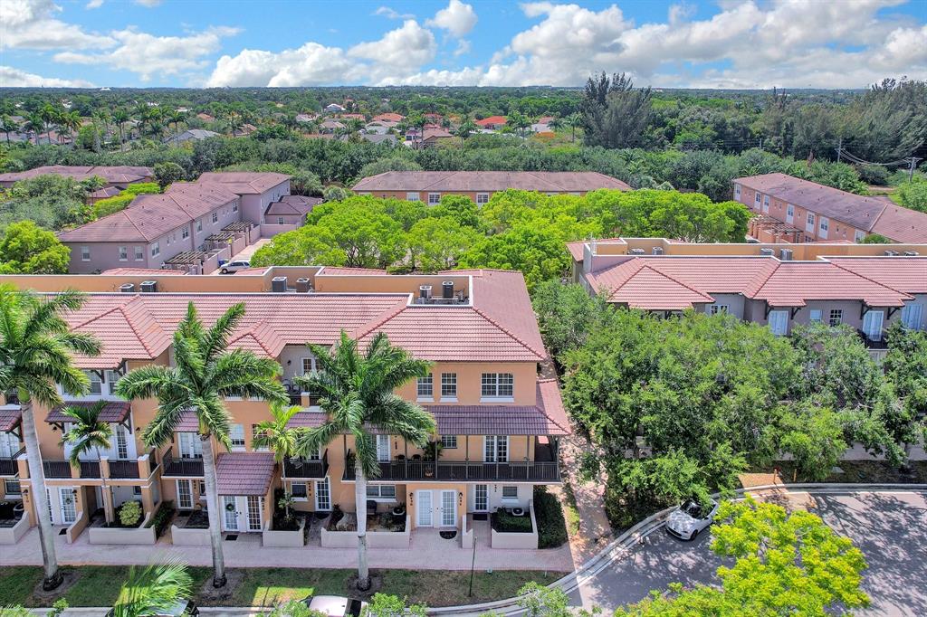 454 Southwest 147th Avenue, Unit 4601 Pembroke Pines, FL 33027 - Photo 41 of 45 an aerial view of multiple houses with yard