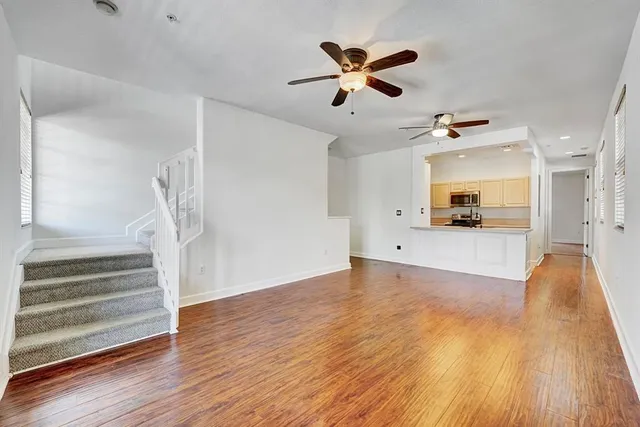 a view of a living room and wooden floor