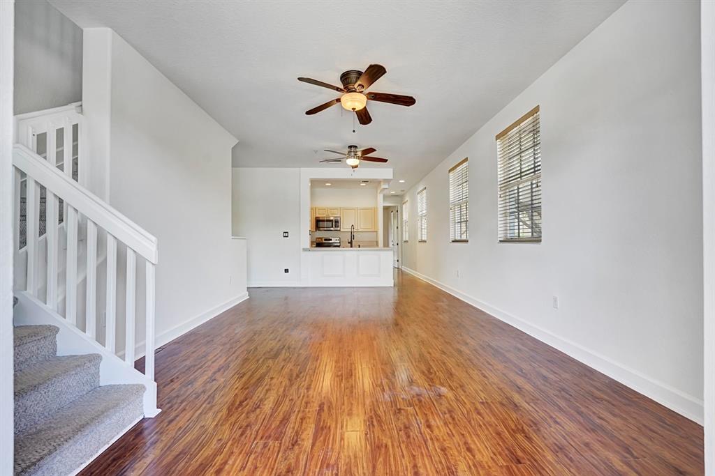 454 Southwest 147th Avenue, Unit 4601 Pembroke Pines, FL 33027 - Photo 8 of 45 a view of a hallway with wooden floor and a chandelier