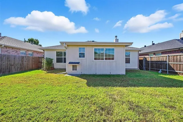 a view of a backyard with a garden and plants