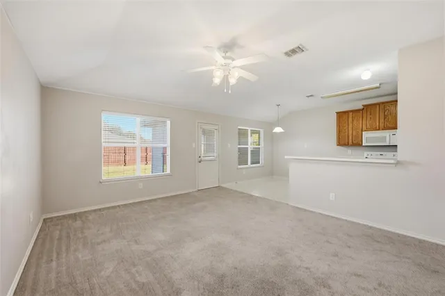 a view of an empty room with a window
