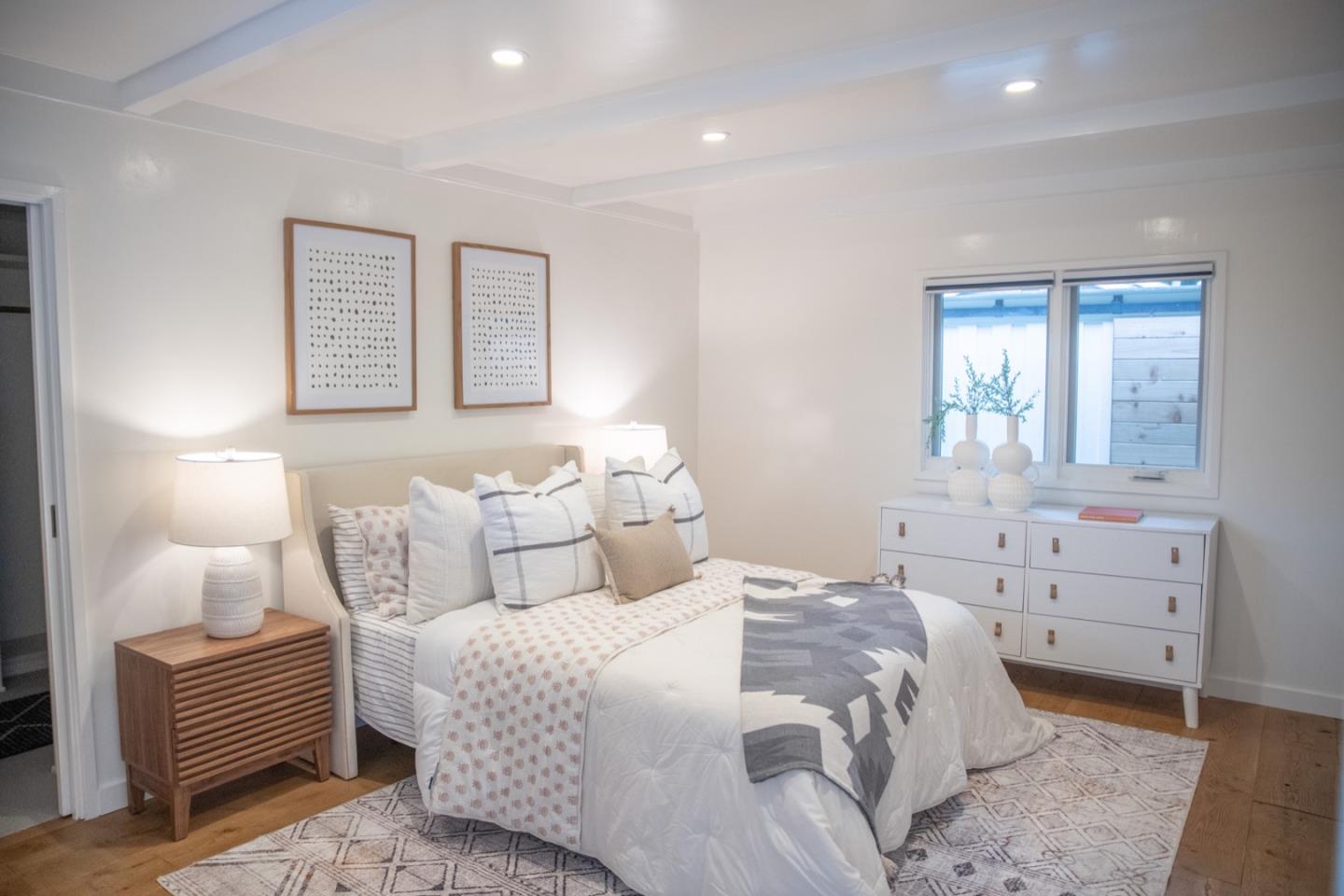 25990 Junipero Street Carmel, CA 93923 - Photo 11 of 26 a bedroom with a bed and a dresser