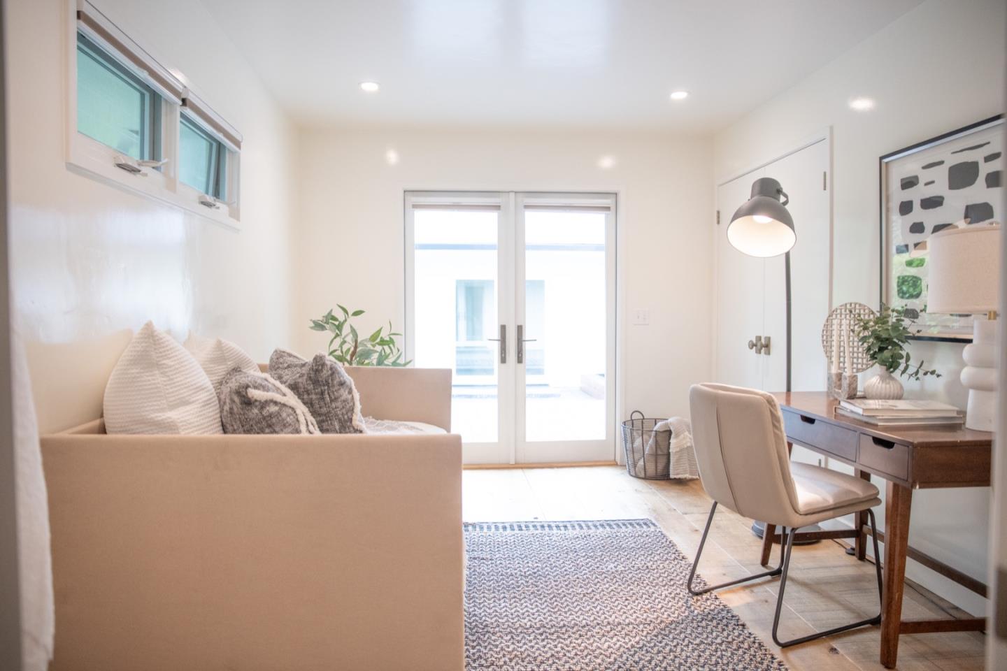 25990 Junipero Street Carmel, CA 93923 - Photo 14 of 26 a living room with furniture and a large window