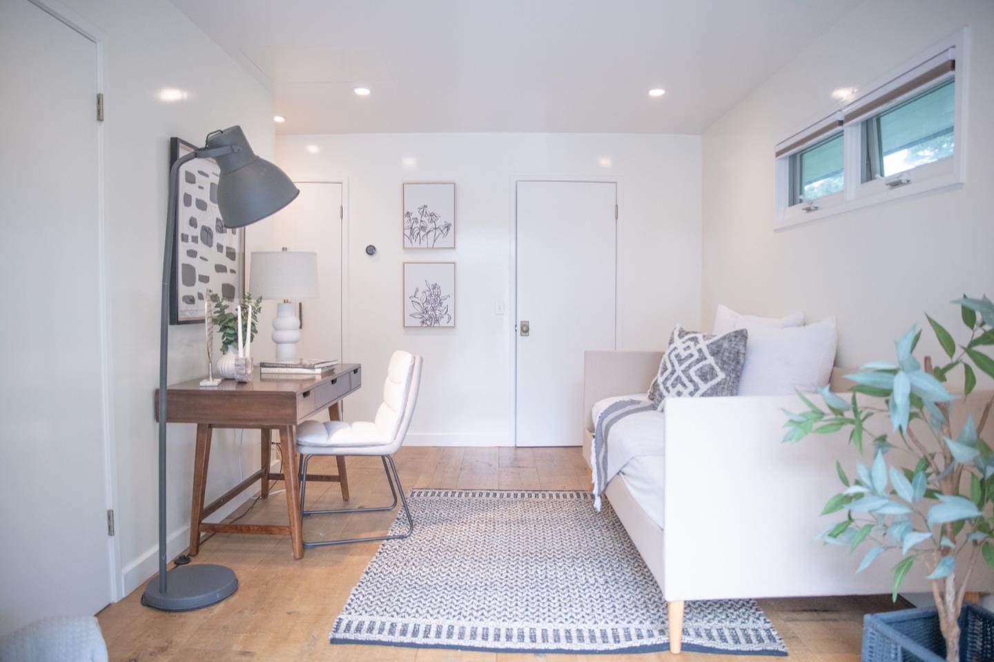 25990 Junipero Street Carmel, CA 93923 - Photo 15 of 26 a living room with furniture and a potted plant