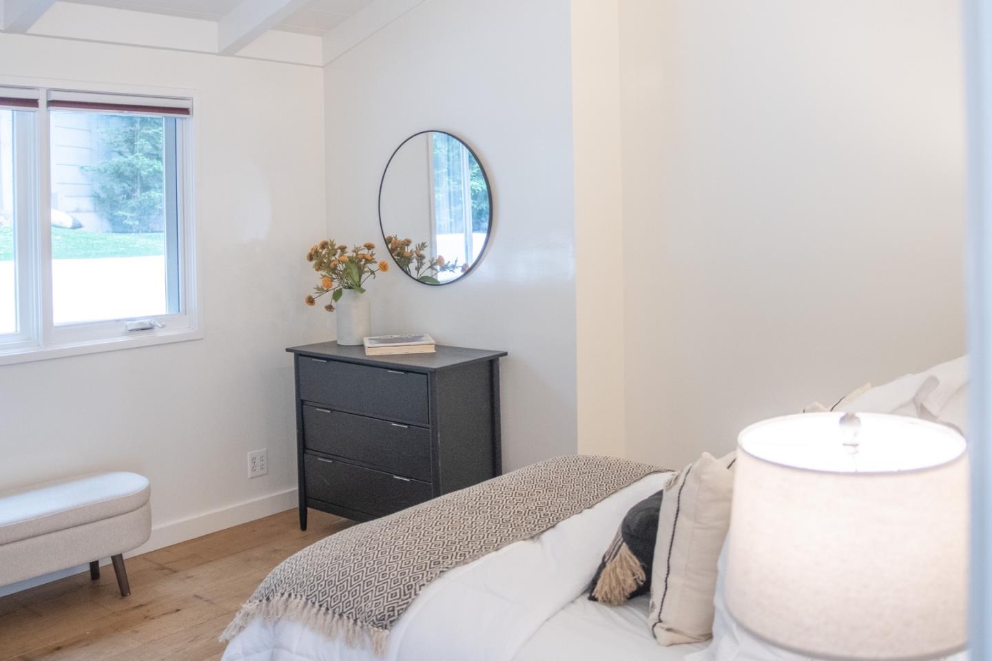 25990 Junipero Street Carmel, CA 93923 - Photo 19 of 26 a bedroom with a bed and a dresser