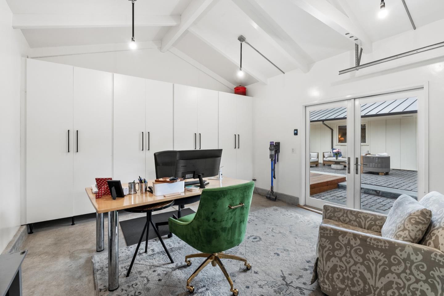 25990 Junipero Street Carmel, CA 93923 - Photo 22 of 26 a living room with furniture and a flat screen tv