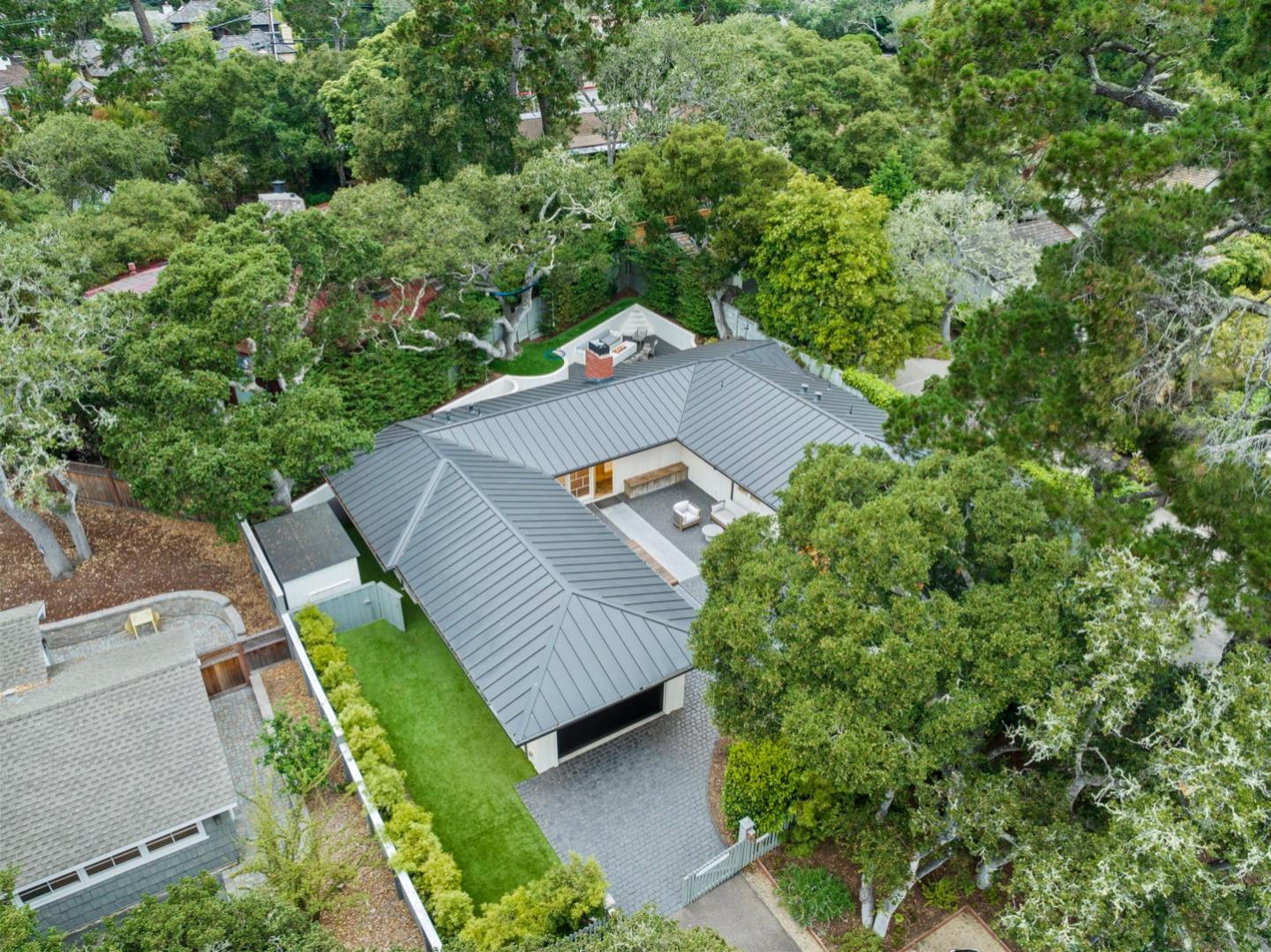 25990 Junipero Street Carmel, CA 93923 - Photo 23 of 26 an aerial view of a house with a yard and trees