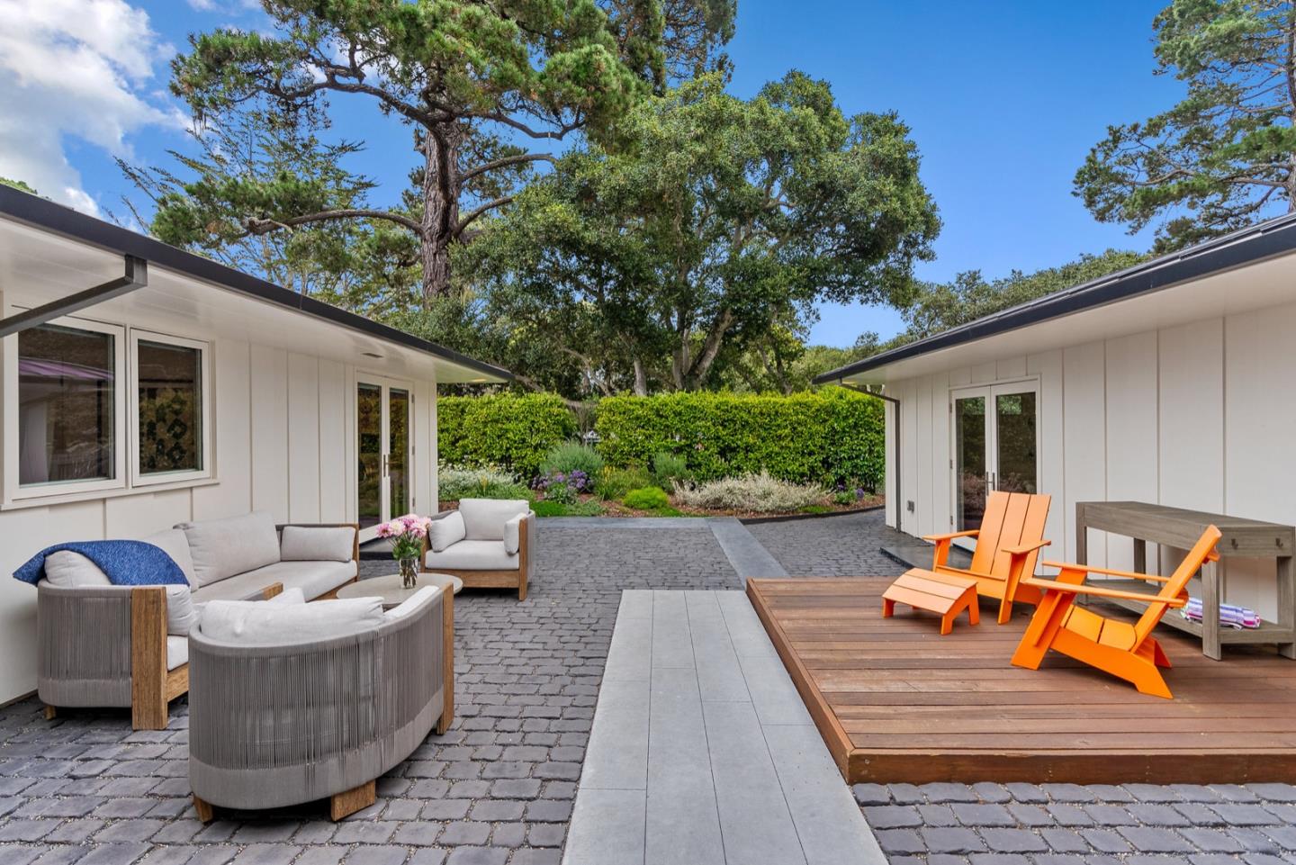 25990 Junipero Street Carmel, CA 93923 - Photo 3 of 26 a view of a patio with couches and potted plants