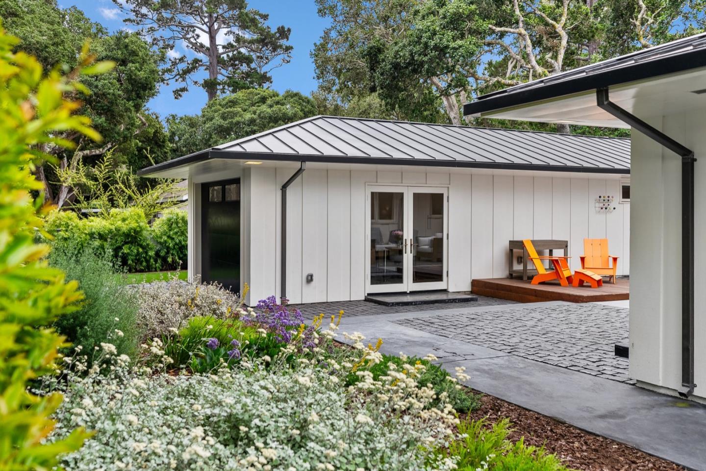 25990 Junipero Street Carmel, CA 93923 - Photo 5 of 26 a front view of a house with garden