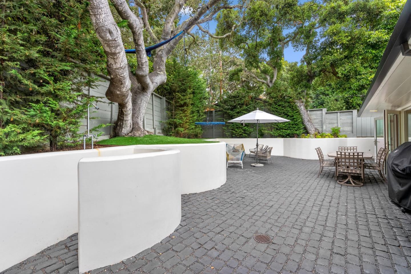 25990 Junipero Street Carmel, CA 93923 - Photo 6 of 26 a view of backyard with a patio and garden