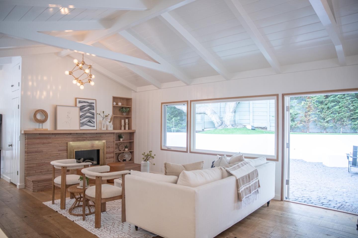 25990 Junipero Street Carmel, CA 93923 - Photo 7 of 26 a living room with furniture and a large window