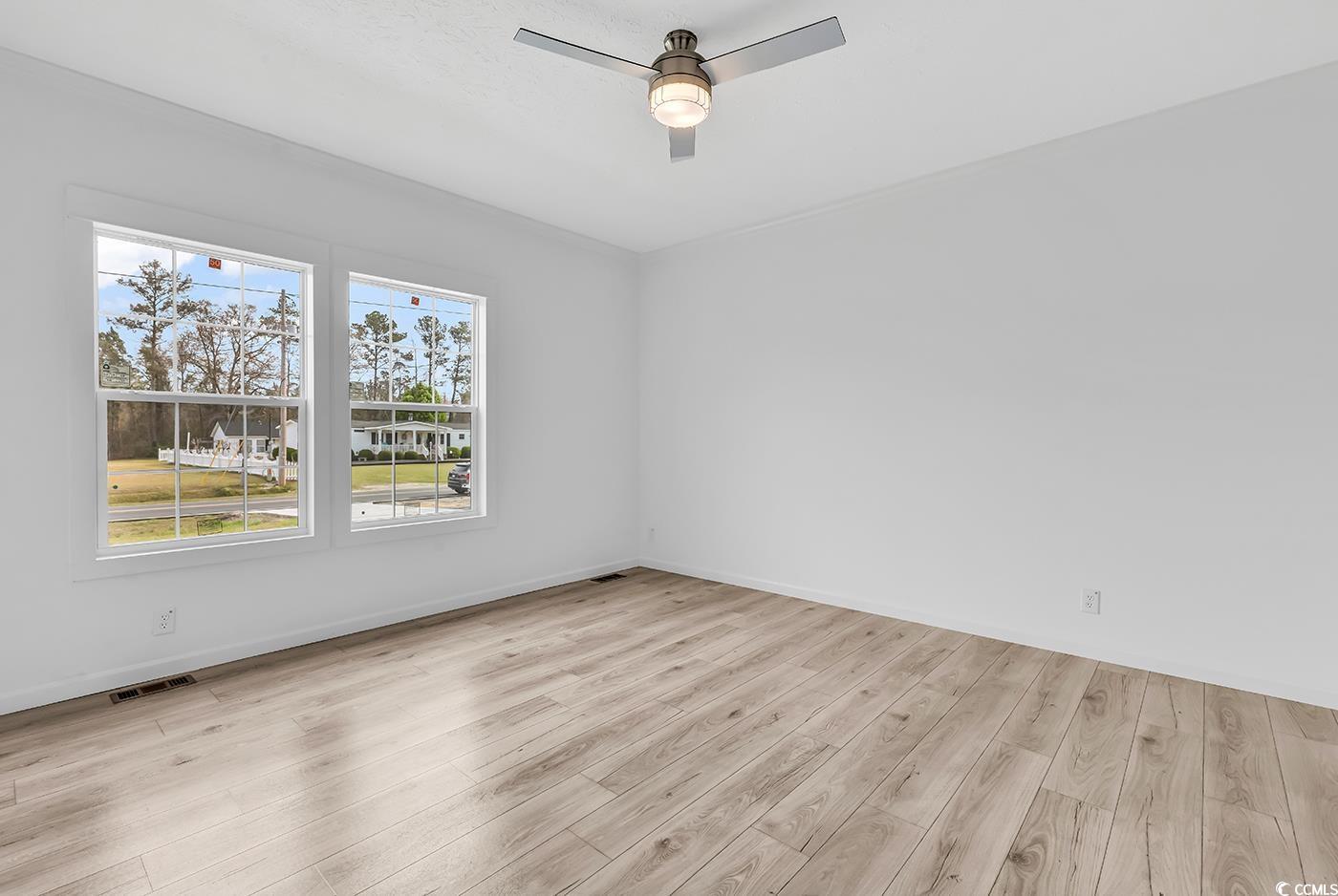 7740 Kerl Road Conway, SC 29526 - Photo 20 of 39 Unfurnished room featuring ceiling fan, baseboards, light wood finished floors, and visible vents