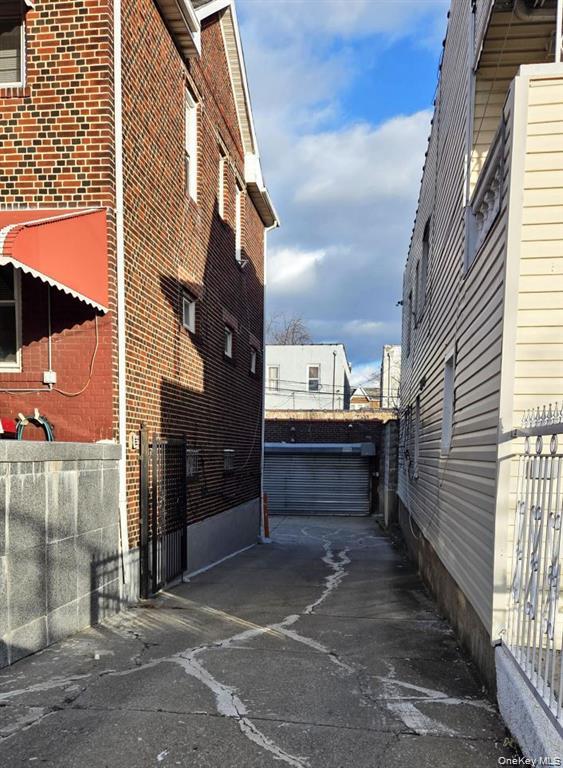 25-55 97th Street Queens, NY 11369 - Photo 11 of 15 a view of a house with a street