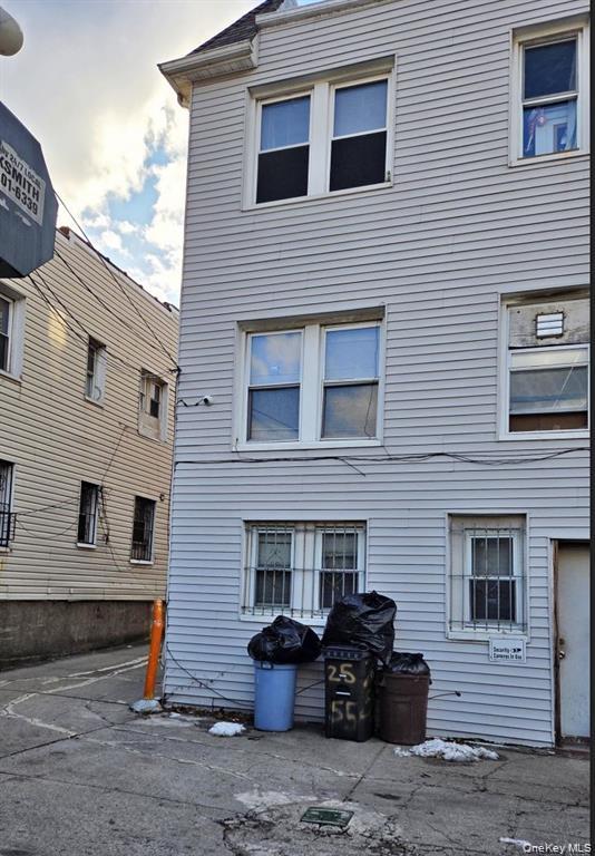 25-55 97th Street Queens, NY 11369 - Photo 13 of 15 a front view of a house with garage