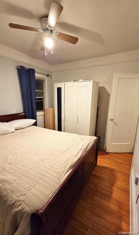 25-55 97th Street Queens, NY 11369 - Photo 4 of 15 a bed sitting in a bedroom next to a window