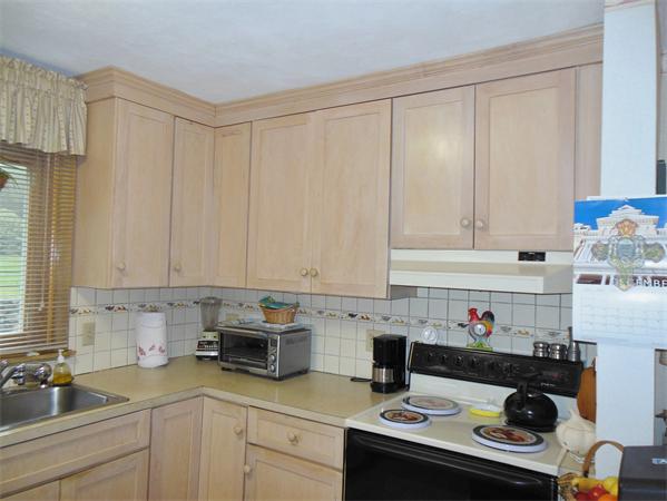 22 Jacqueline Road, Unit D Waltham, MA 02452 - Photo 3 of 11 a kitchen with a sink and cabinets