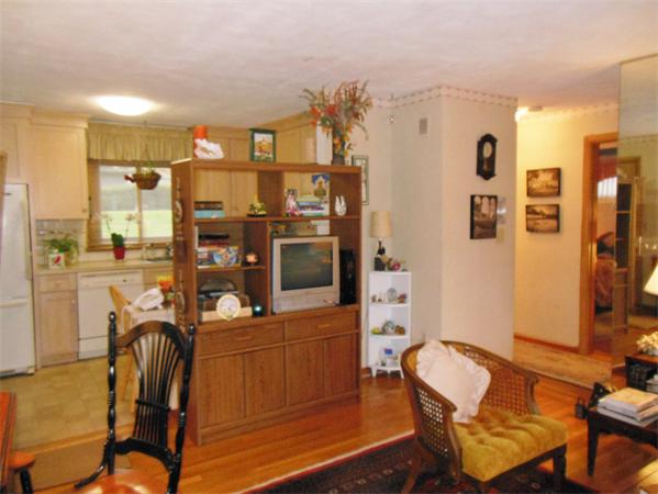 22 Jacqueline Road, Unit D Waltham, MA 02452 - Photo 5 of 11 a workspace with furniture and chandelier