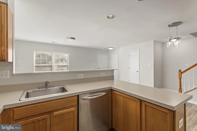 a kitchen with a sink and a window