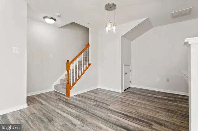 a view of an entryway with wooden floor