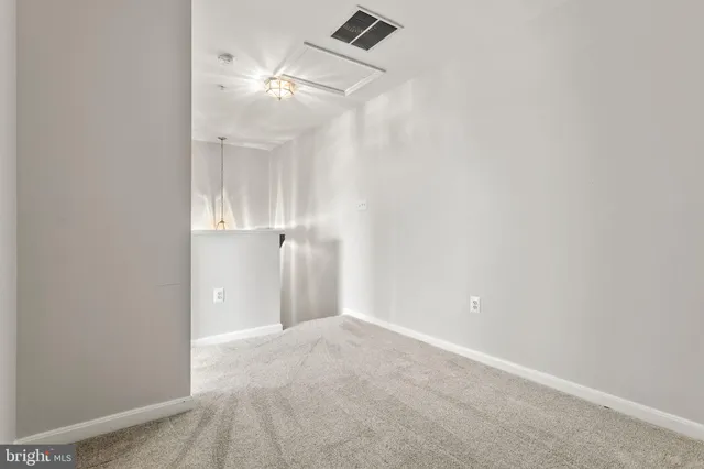 an empty room with a bathroom