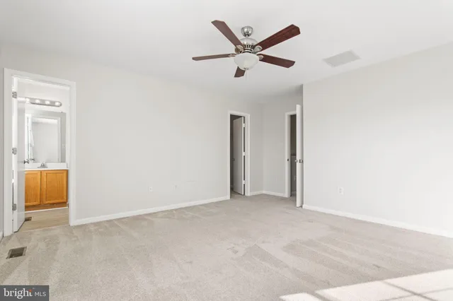 an empty room with a bathroom