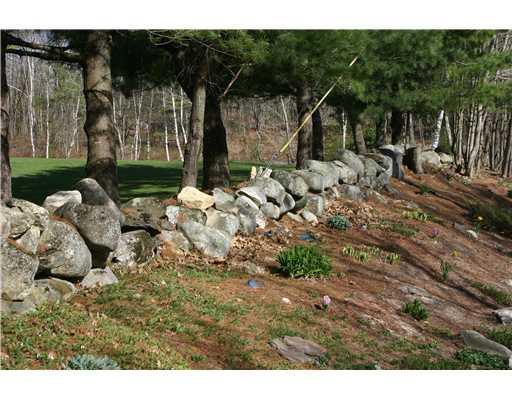 36 Pulsifer Road Poland, ME 04274 - Photo 5 of 19 Land. Rock wall with beautiful perenials