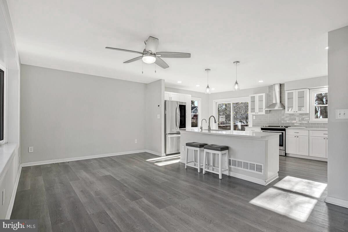 735 Whitehall Beach Road Annapolis, MD 21409 - Photo 2 of 35 a view of kitchen with cabinets and wooden floor