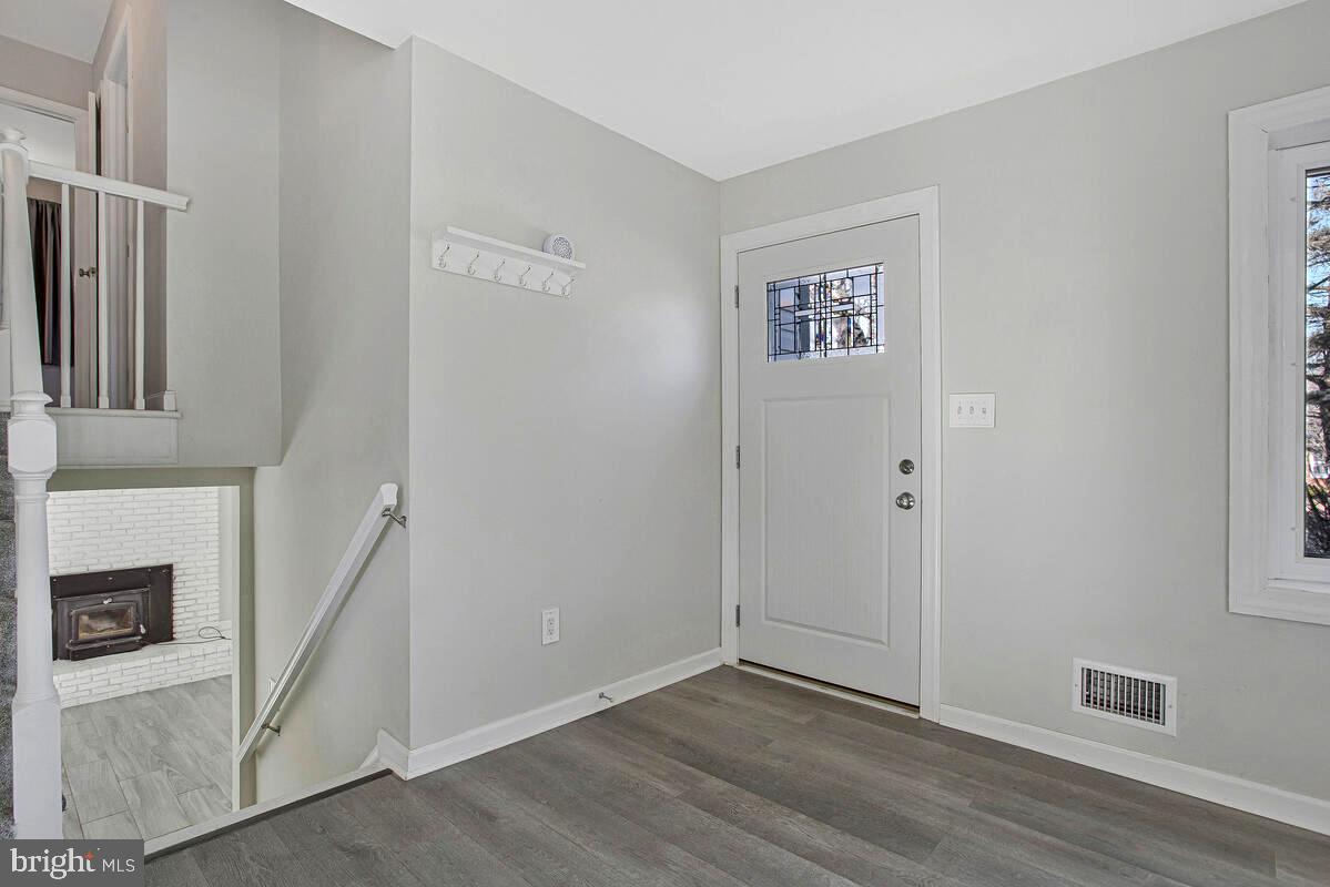 735 Whitehall Beach Road Annapolis, MD 21409 - Photo 3 of 35 a view of an entryway with wooden floor