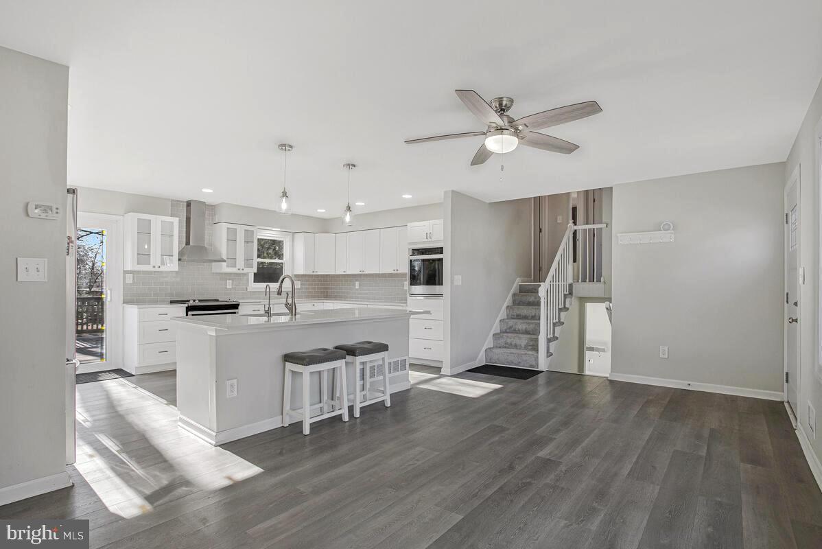735 Whitehall Beach Road Annapolis, MD 21409 - Photo 35 of 35 a view of kitchen with wooden floor and electronic appliances