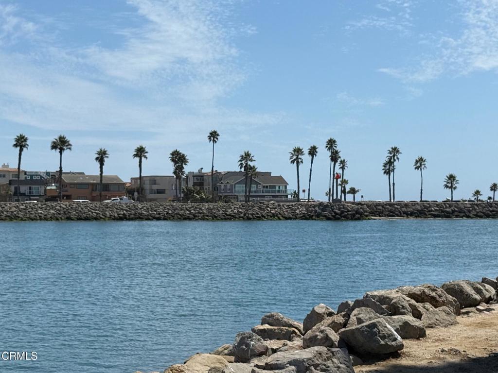 920 Catamaran Street Oxnard, CA 93035 - Photo 11 of 17 a view of a lake with boats and trees in the background
