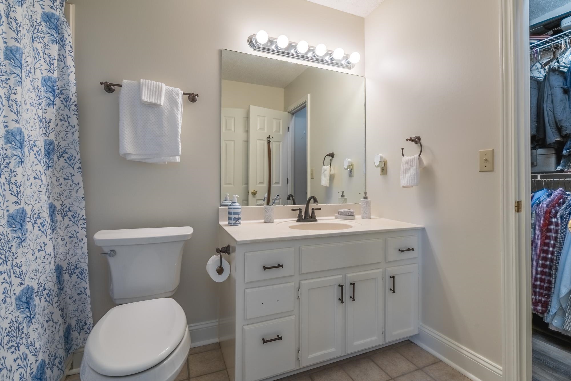 192 Madison Drive Atoka, TN 38004 - Photo 12 of 23 a bathroom with a toilet a sink and mirror
