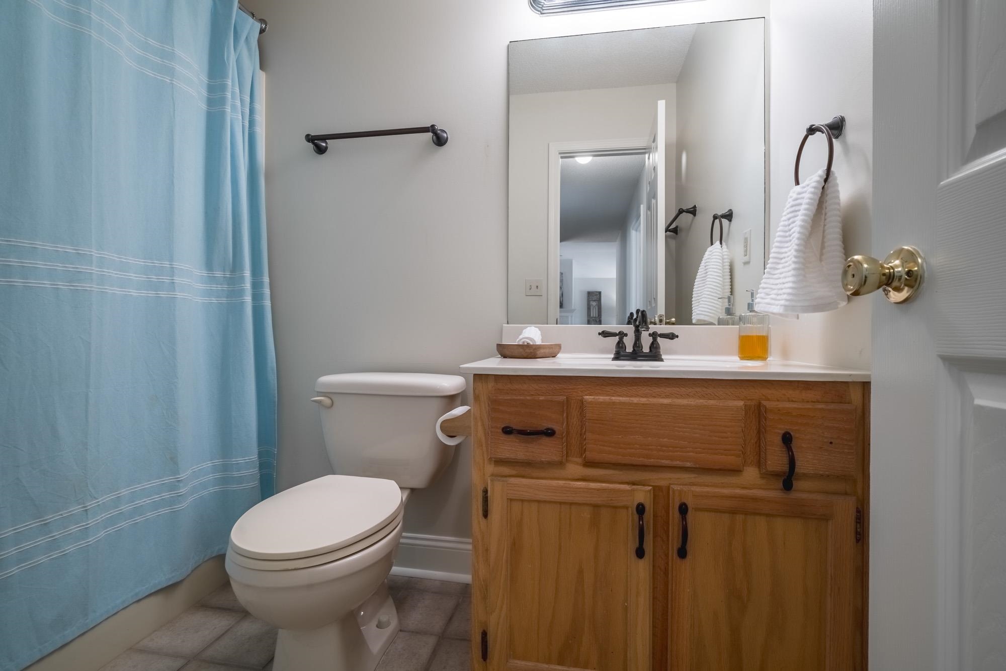 192 Madison Drive Atoka, TN 38004 - Photo 13 of 23 a bathroom with a sink vanity mirror and toilet
