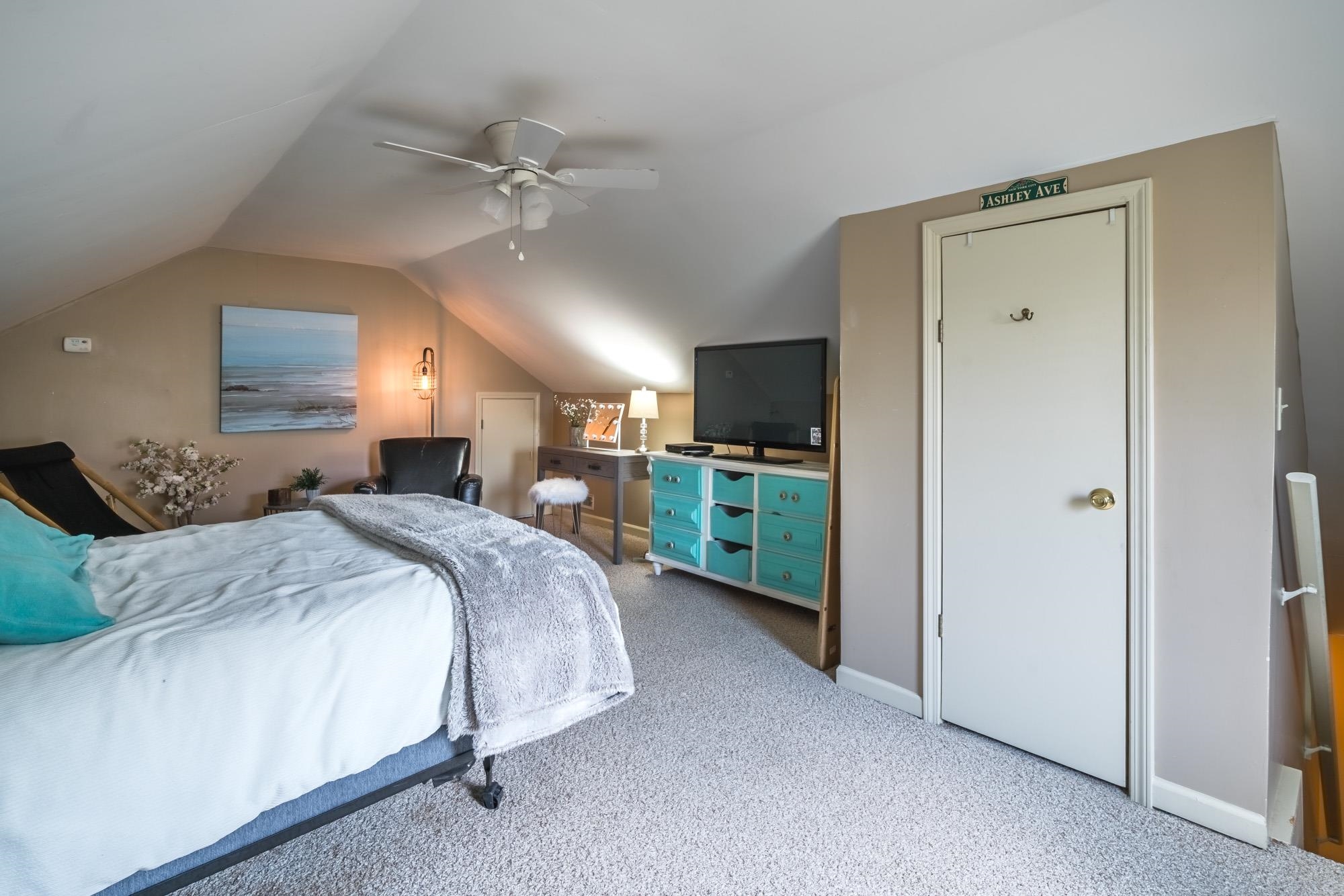 192 Madison Drive Atoka, TN 38004 - Photo 14 of 23 a spacious bedroom with a bed and a chandelier