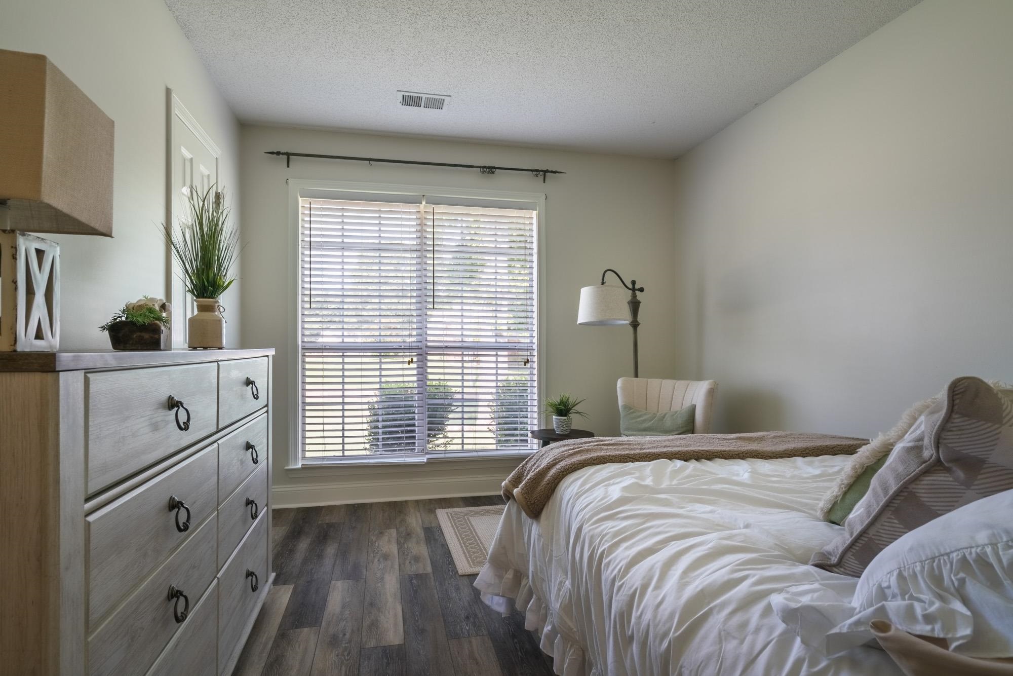192 Madison Drive Atoka, TN 38004 - Photo 20 of 23 a bedroom with a bed and a large window