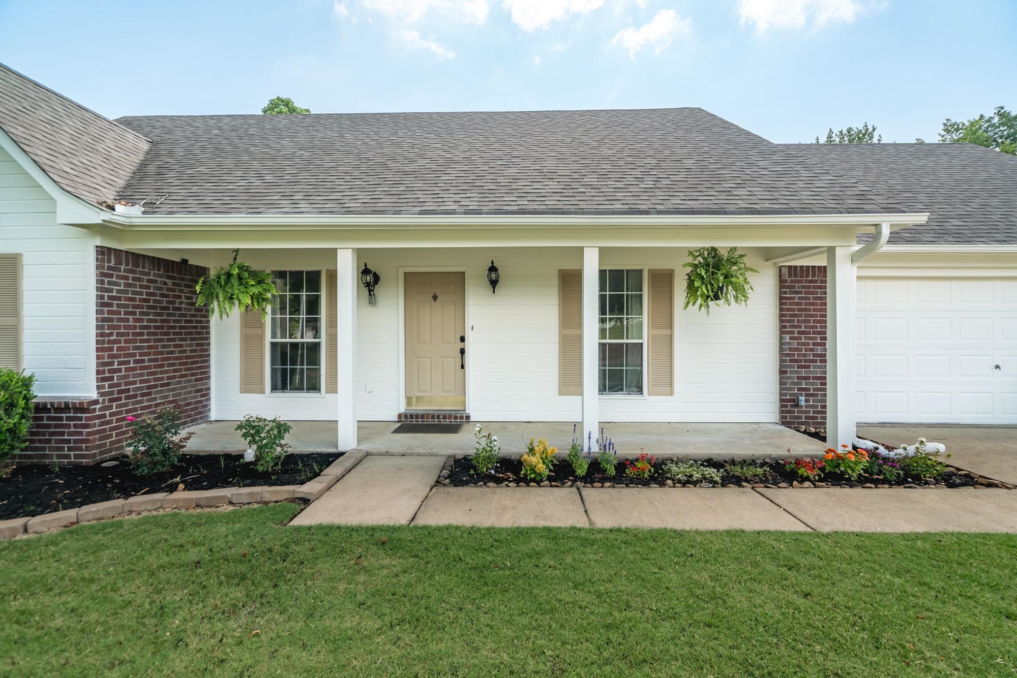 192 Madison Drive Atoka, TN 38004 - Photo 2 of 23 front view of a house with a yard