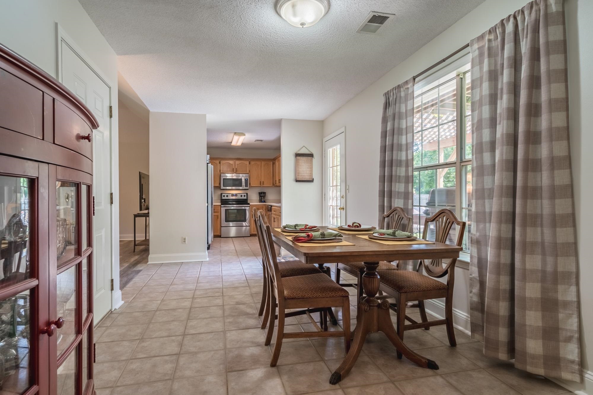 192 Madison Drive Atoka, TN 38004 - Photo 9 of 23 a view of a dining room with furniture and window