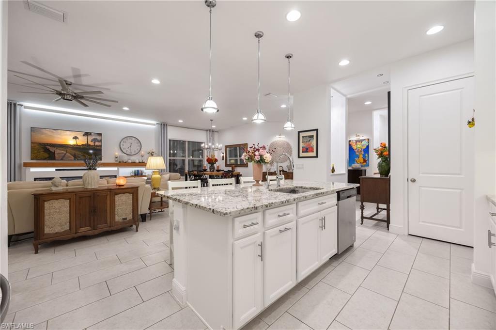 3620 Pilot Circle Naples, FL 34120 - Photo 20 of 49 a kitchen with stainless steel appliances granite countertop a sink and cabinets